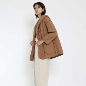 Unisex 7115 by Szeki Hooded Quilted Jacket